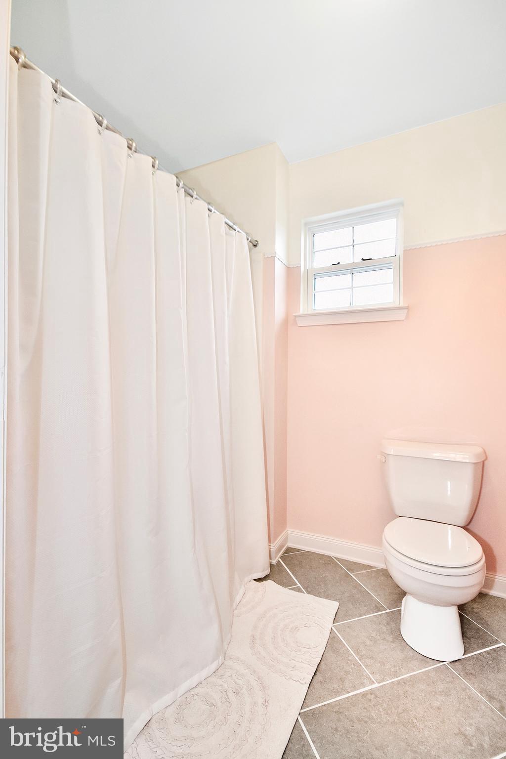 102 Peregrine Lane Hummelstown, PA 17036 - Photo 20 of 28 a bathroom with a toilet and a shower curtain