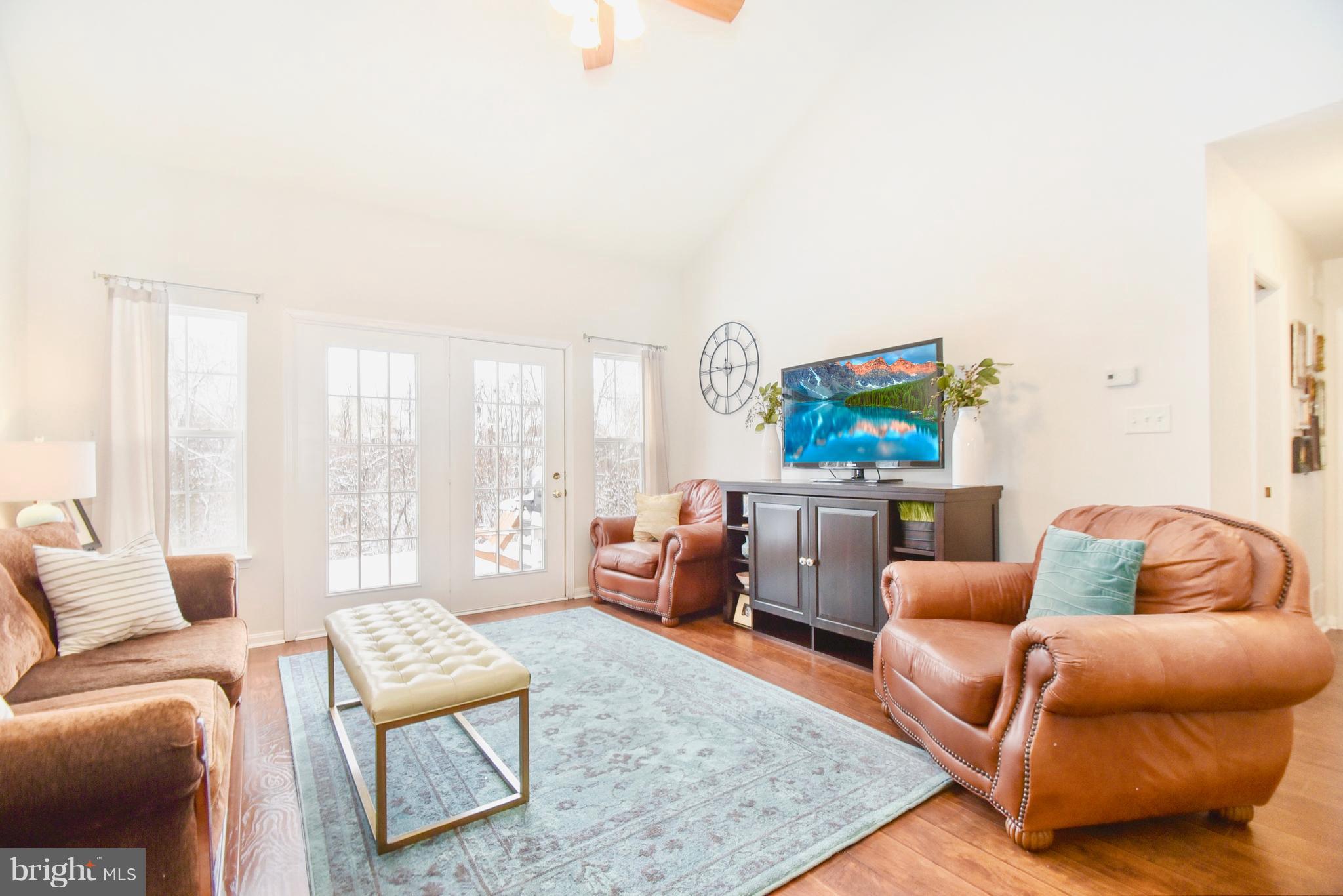 102 Peregrine Lane Hummelstown, PA 17036 - Photo 2 of 28 a living room with furniture and a couch