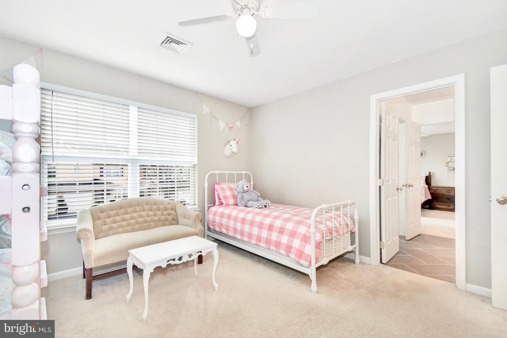 102 Peregrine Lane Hummelstown, PA 17036 - Photo 21 of 28 a bedroom with a bed and a couch