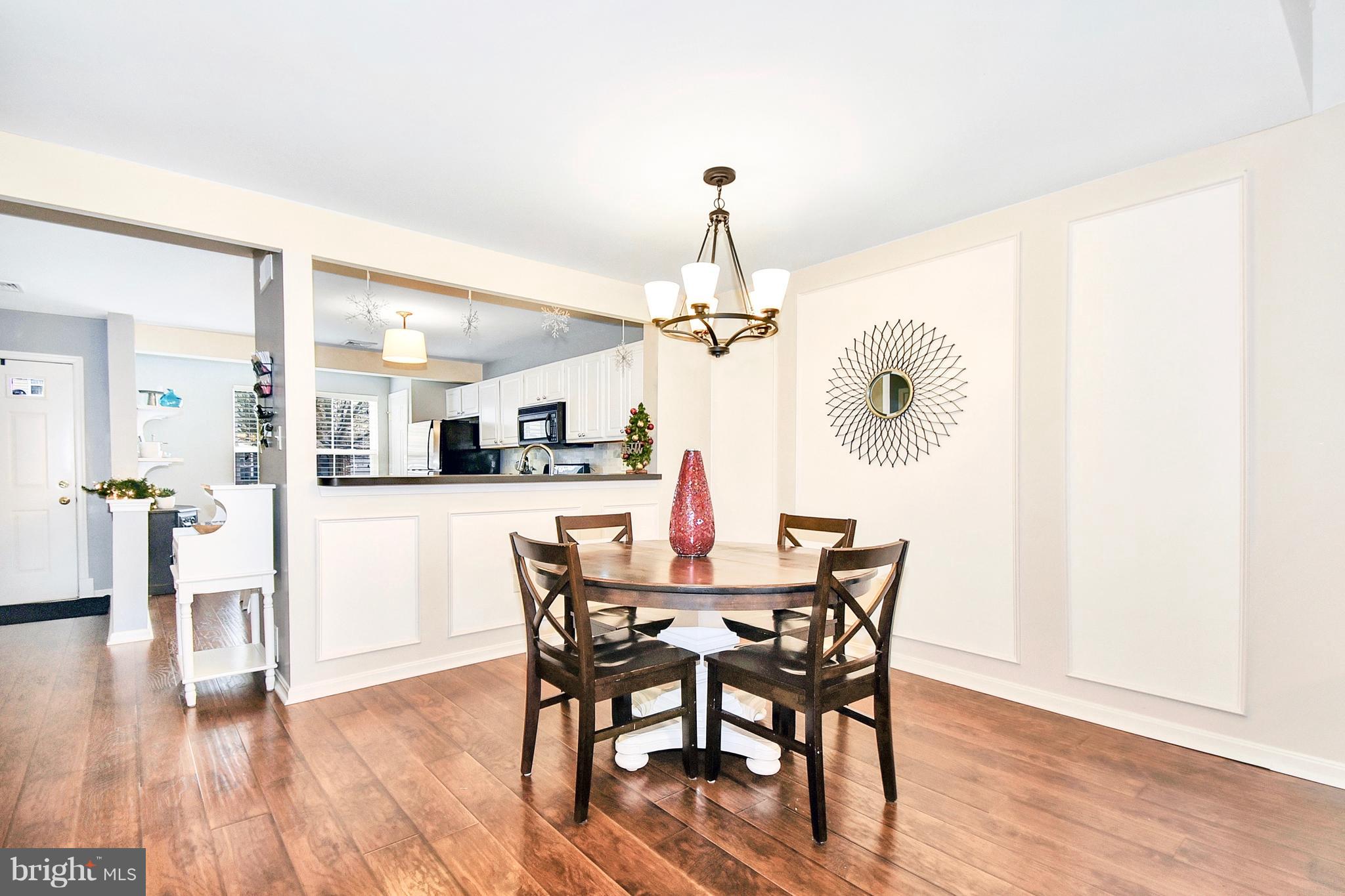 102 Peregrine Lane Hummelstown, PA 17036 - Photo 4 of 28 a view of a dining room with furniture and wooden floor