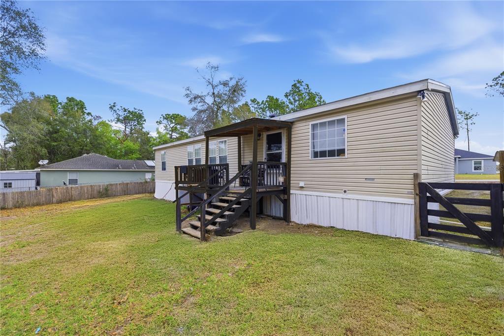 12400 Southeast 99th Terrace Belleview, FL 34420 - Photo 19 of 20 a view of a backyard with a sitting area