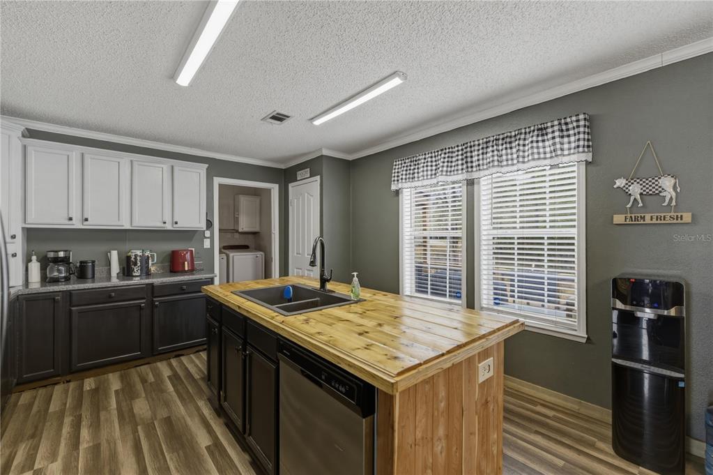 12400 Southeast 99th Terrace Belleview, FL 34420 - Photo 6 of 20 a kitchen with a stove and a sink