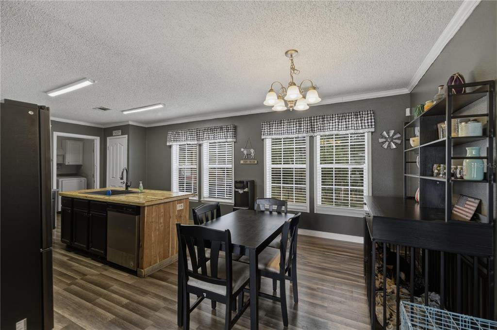 12400 Southeast 99th Terrace Belleview, FL 34420 - Photo 7 of 20 a view of a dining room with furniture window and outside view