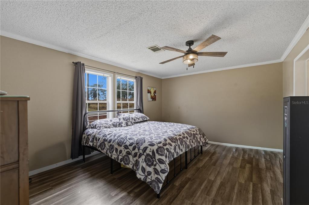 12400 Southeast 99th Terrace Belleview, FL 34420 - Photo 10 of 20 a bedroom with a bed and a window