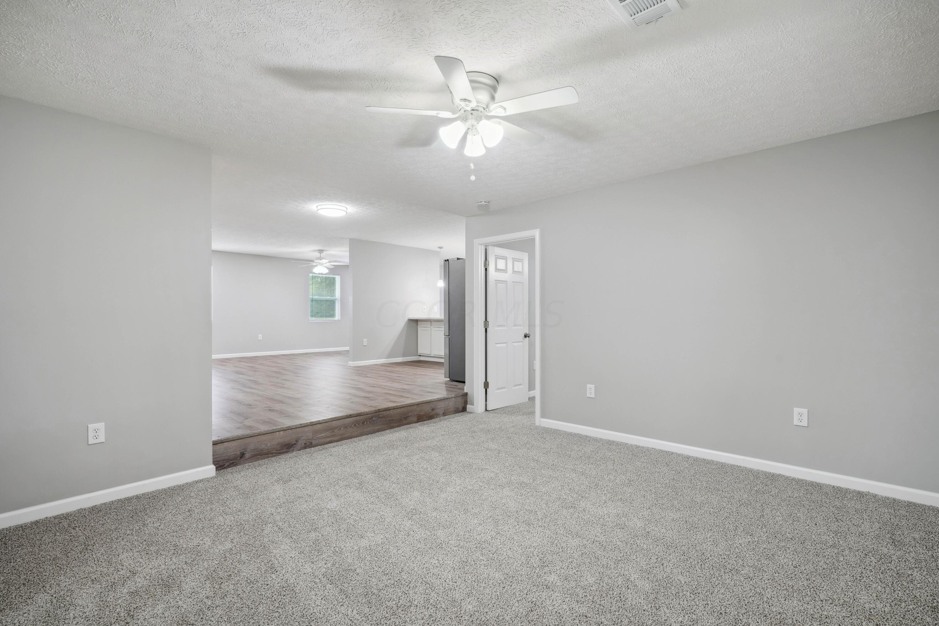 6705 Johnson Road Galloway, OH 43119 - Photo 12 of 30 Step down to Family Room with French doors, leading to the covered back patio!