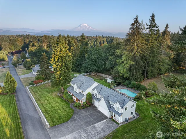 an aerial view of a house with a garden