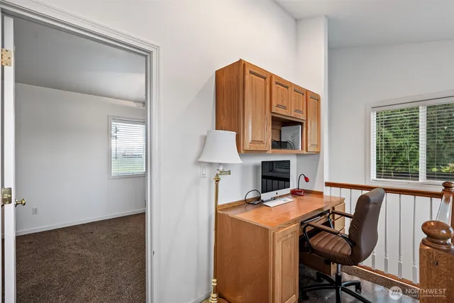 a view of a kitchen with furniture and a fireplace