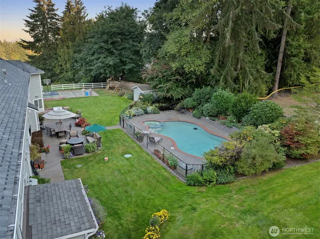 an aerial view of a house with garden space sitting space and trees