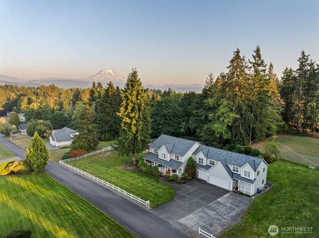 an aerial view of a house with outdoor space
