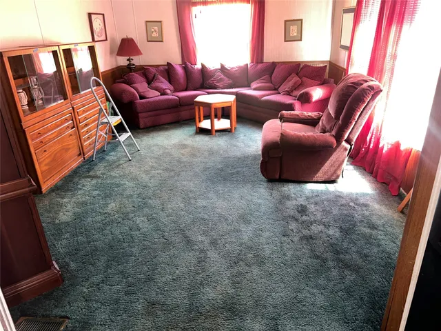 a living room with furniture and a couch