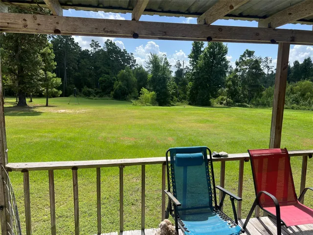 a view of a two chairs in the deck