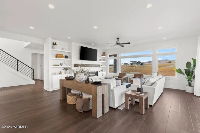 a living room with furniture and a large window