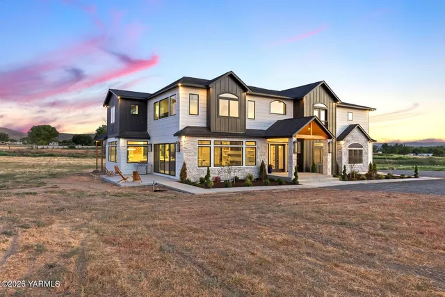 a view of a lake with houses in the background
