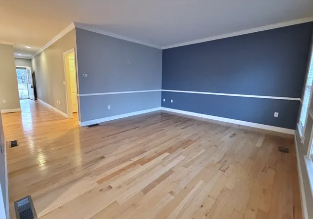 a bathroom with a granite countertop sink a toilet and a mirror