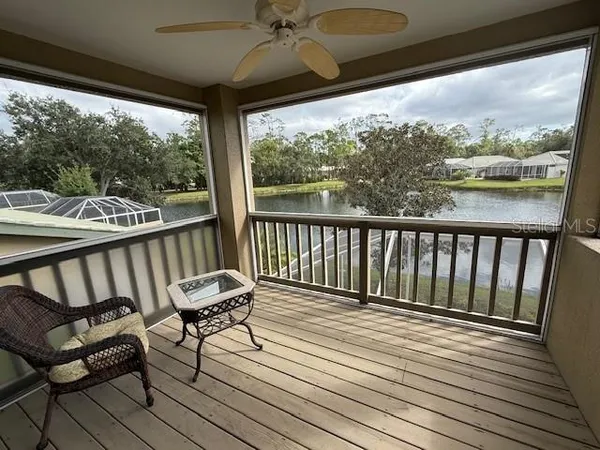a view of a two chairs in the balcony