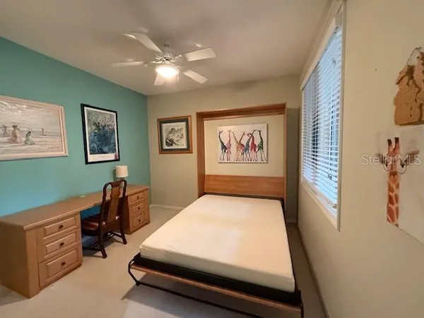a room with a bed and a chandelier