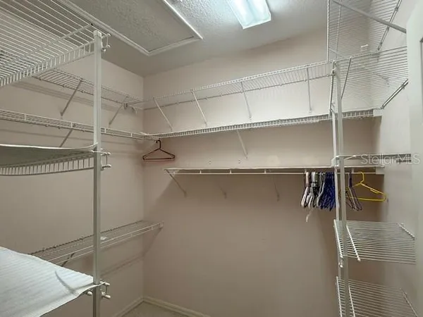 a view of a room with racks on the wall