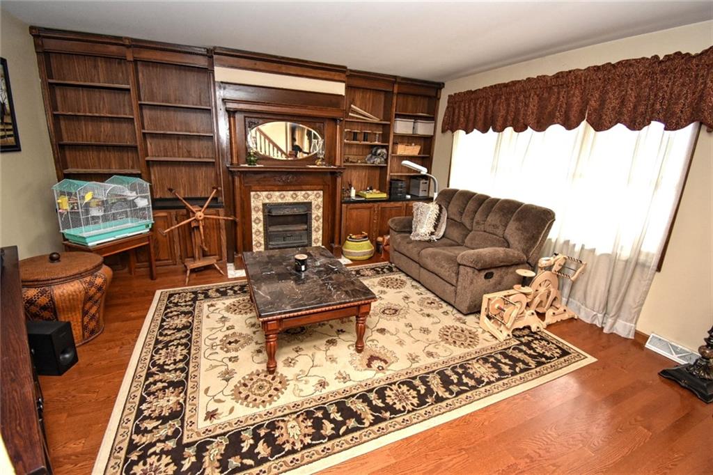 235 Sanitarium Road Washington, PA 15301 - Photo 14 of 25 Just LOOK at the gorgeous woodwork details in the Living Room, complete with another original Fireplace!