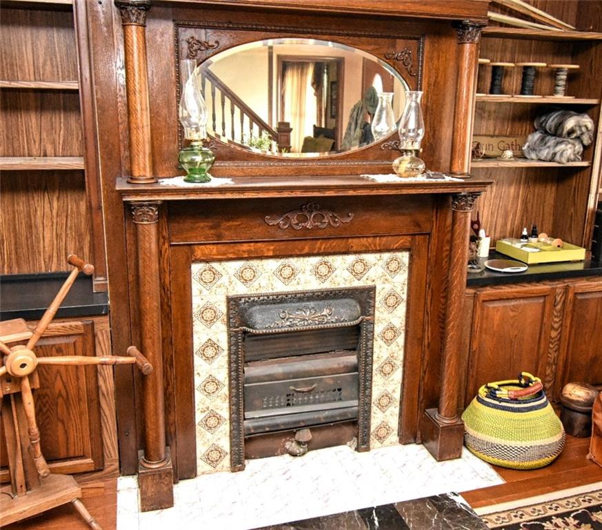 235 Sanitarium Road Washington, PA 15301 - Photo 16 of 25 Original Woodwork surrounds this Fireplace the is situated in the Living Room and welcomes guests as they come through the front door of the home.