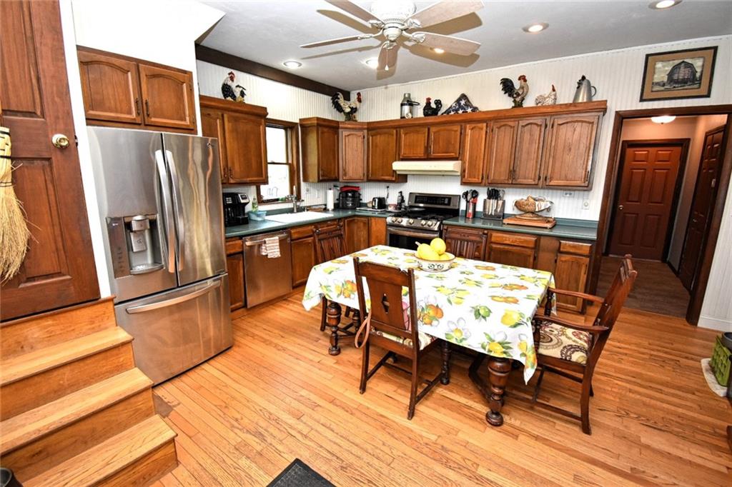 235 Sanitarium Road Washington, PA 15301 - Photo 7 of 25 The spacious kitchen comes fully equipped with stainless appliances and a quaint butler's staircase (left) that leads to the second floor.