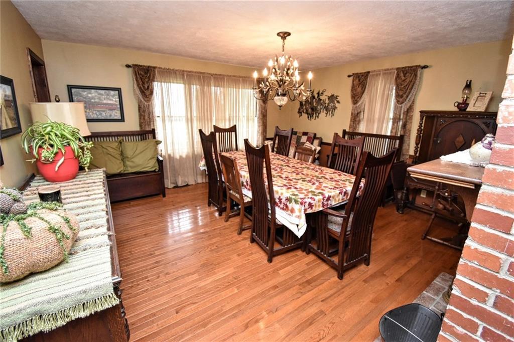 235 Sanitarium Road Washington, PA 15301 - Photo 10 of 25 Gleaming hardwood floors is just one beautiful features of this large Dining Room with Bricked Fireplace.