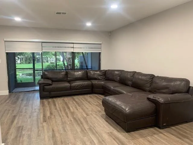 a living room with a couch and a window