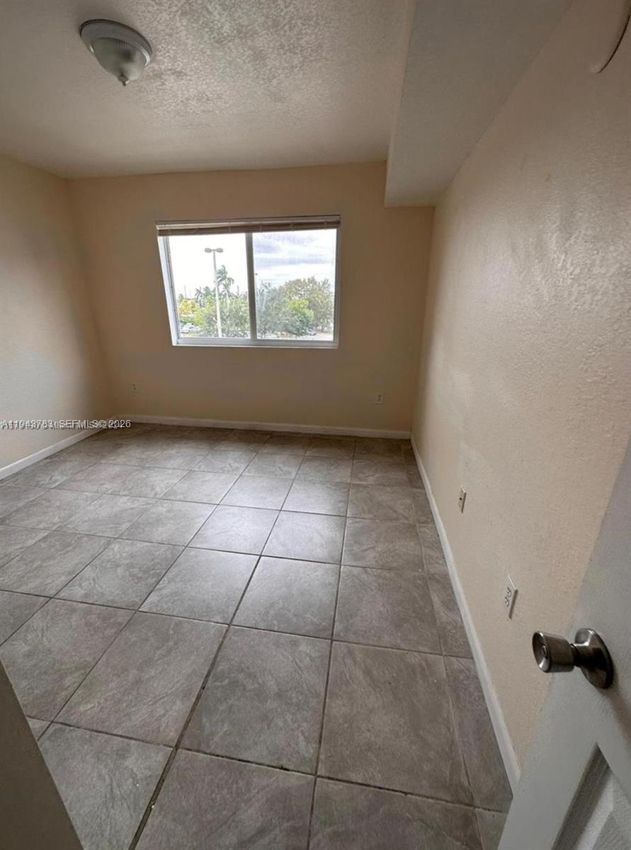 15480 Southwest 284th Street, Unit 2304 Homestead, FL 33033 - Photo 11 of 31 an empty room with windows