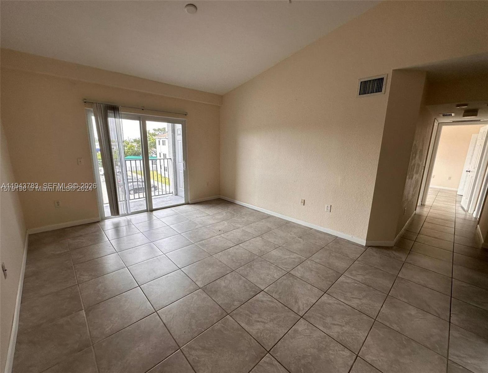15480 Southwest 284th Street, Unit 2304 Homestead, FL 33033 - Photo 13 of 31 a view of an empty room and window