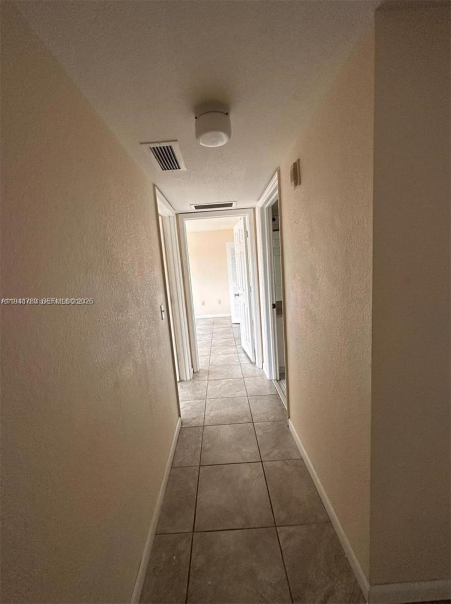 15480 Southwest 284th Street, Unit 2304 Homestead, FL 33033 - Photo 16 of 31 a view of a hallway