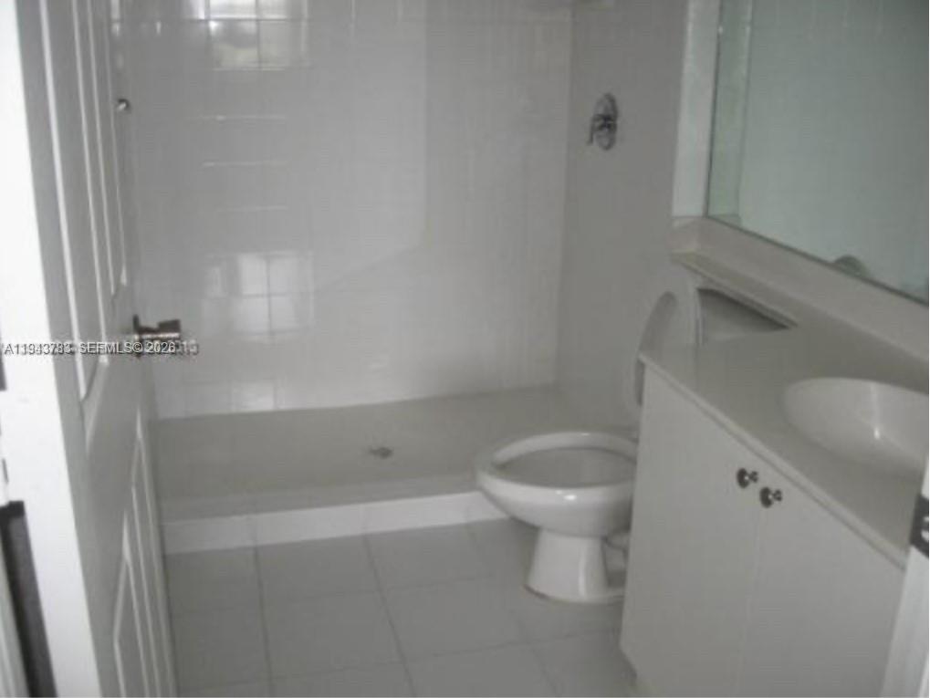 15480 Southwest 284th Street, Unit 2304 Homestead, FL 33033 - Photo 18 of 31 a bathroom with a toilet and a shower