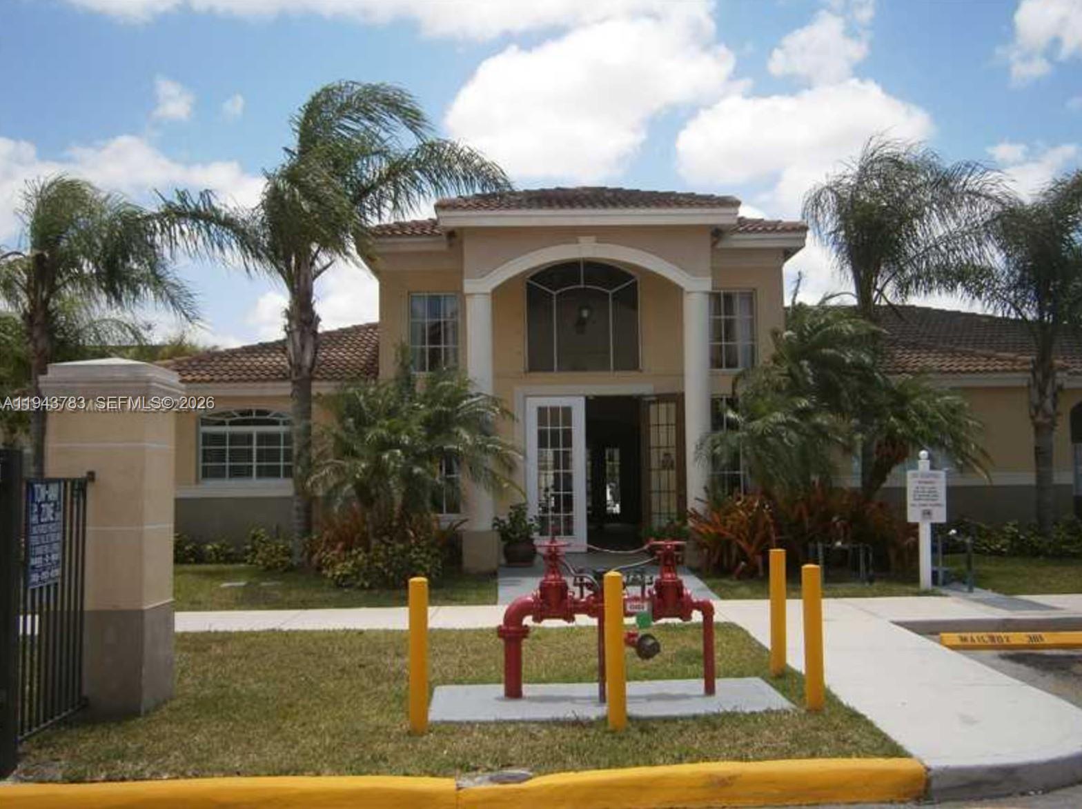 15480 Southwest 284th Street, Unit 2304 Homestead, FL 33033 - Photo 19 of 31 a view of house with outdoor space and tall tree