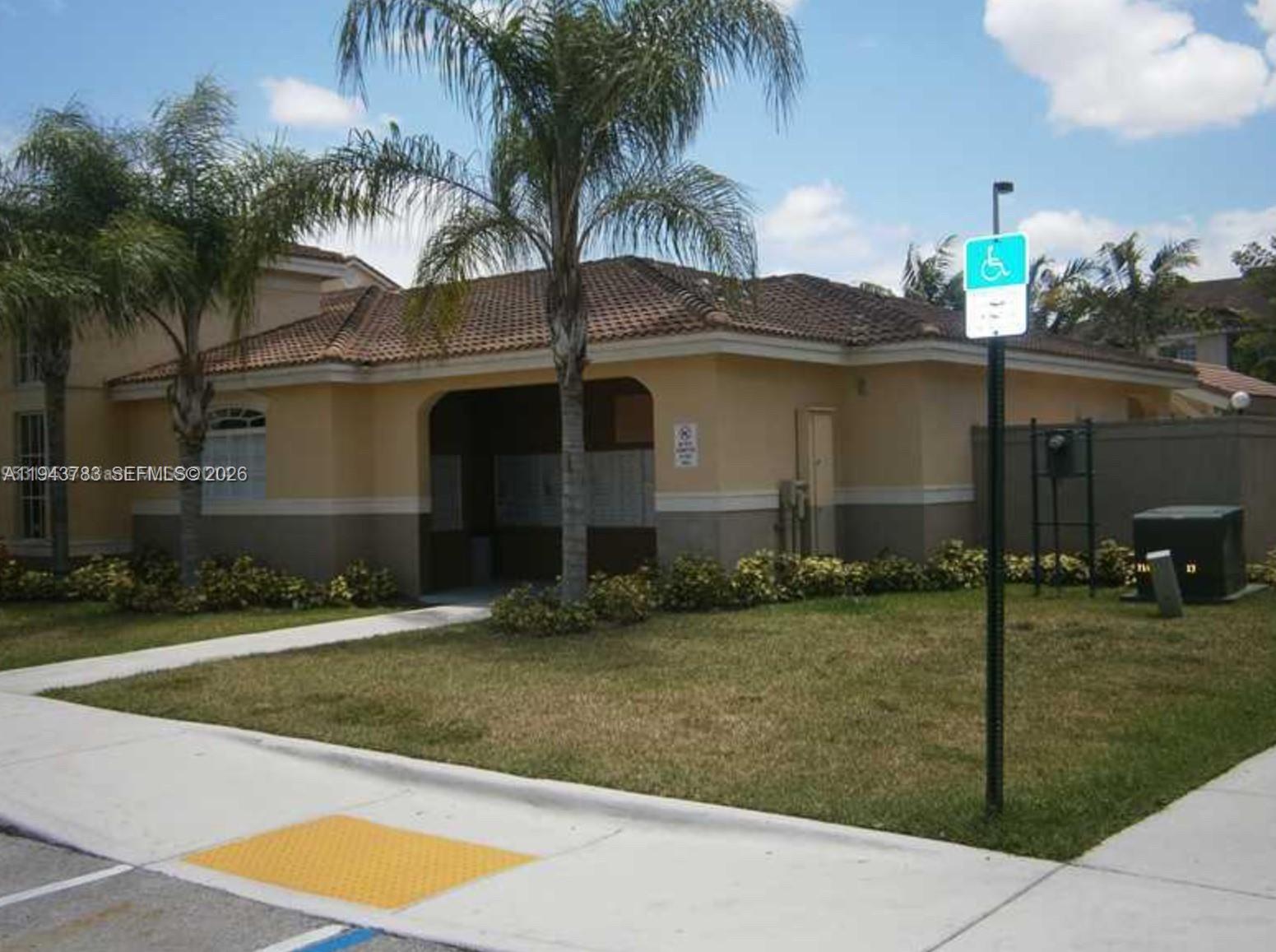 15480 Southwest 284th Street, Unit 2304 Homestead, FL 33033 - Photo 23 of 31 a front view of a house with a yard