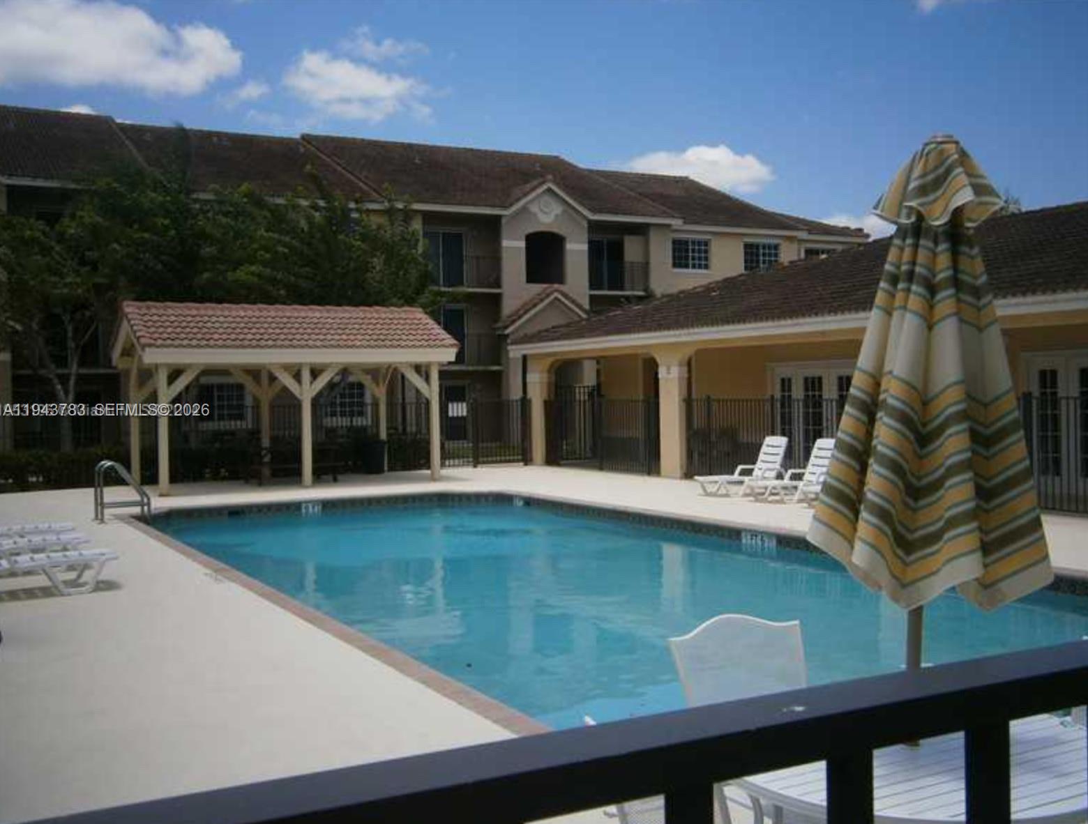 15480 Southwest 284th Street, Unit 2304 Homestead, FL 33033 - Photo 25 of 31 a front view of a house with a yard