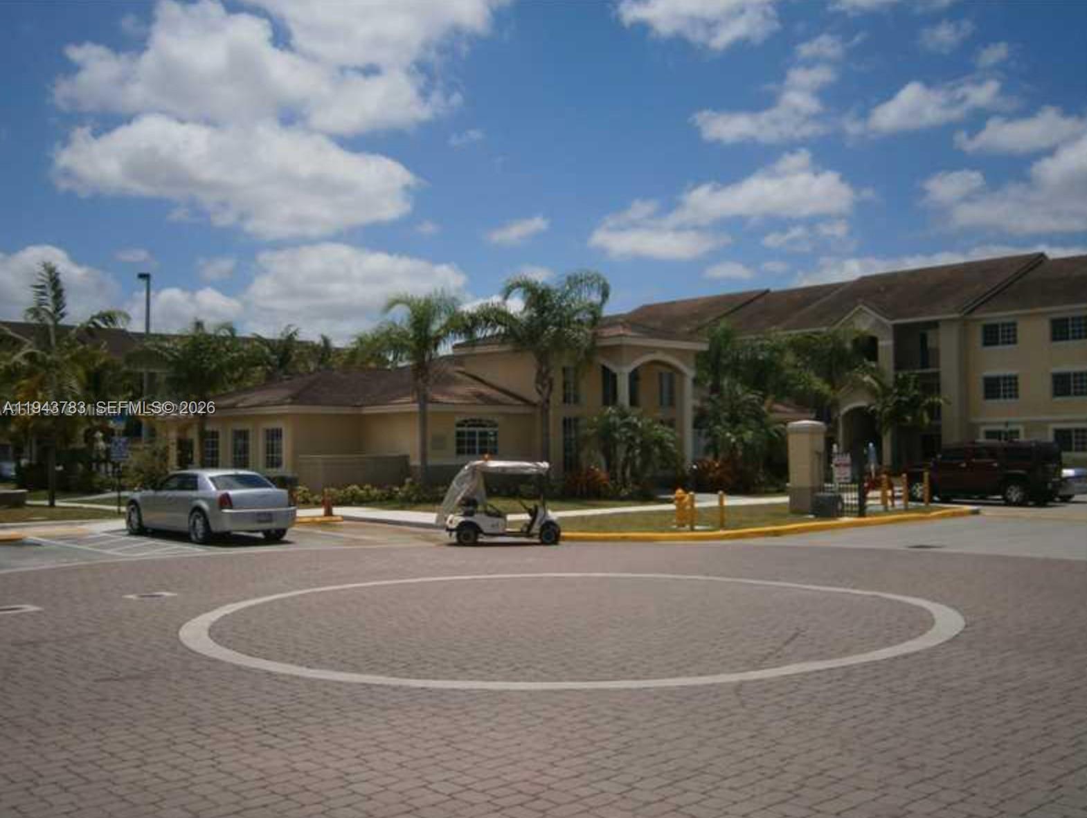 15480 Southwest 284th Street, Unit 2304 Homestead, FL 33033 - Photo 29 of 31 a view of street with parked cars