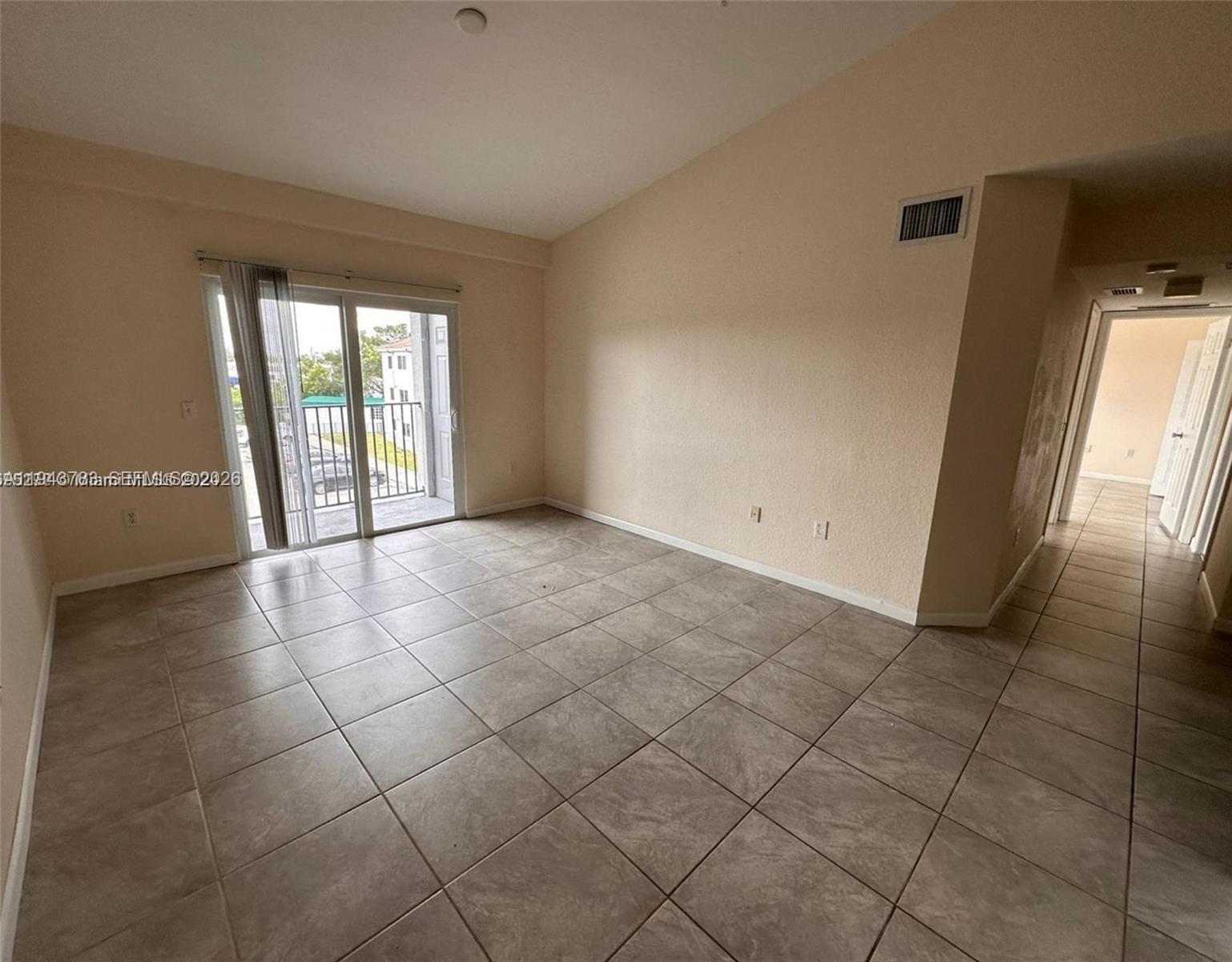 15480 Southwest 284th Street, Unit 2304 Homestead, FL 33033 - Photo 6 of 31 a view of an empty room and window
