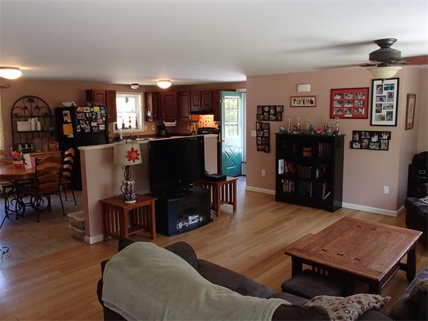 24 Ed Clark Road Colrain, MA 01340 - Photo 12 of 25 a living room with furniture and a flat screen tv