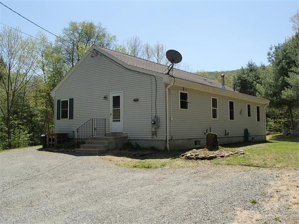 24 Ed Clark Road Colrain, MA 01340 - Photo 2 of 25 a front view of a house with a yard