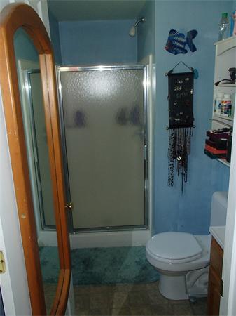 24 Ed Clark Road Colrain, MA 01340 - Photo 22 of 25 a bathroom with a toilet and a mirror