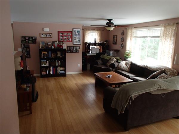 24 Ed Clark Road Colrain, MA 01340 - Photo 7 of 25 a living room with furniture and a flat screen tv