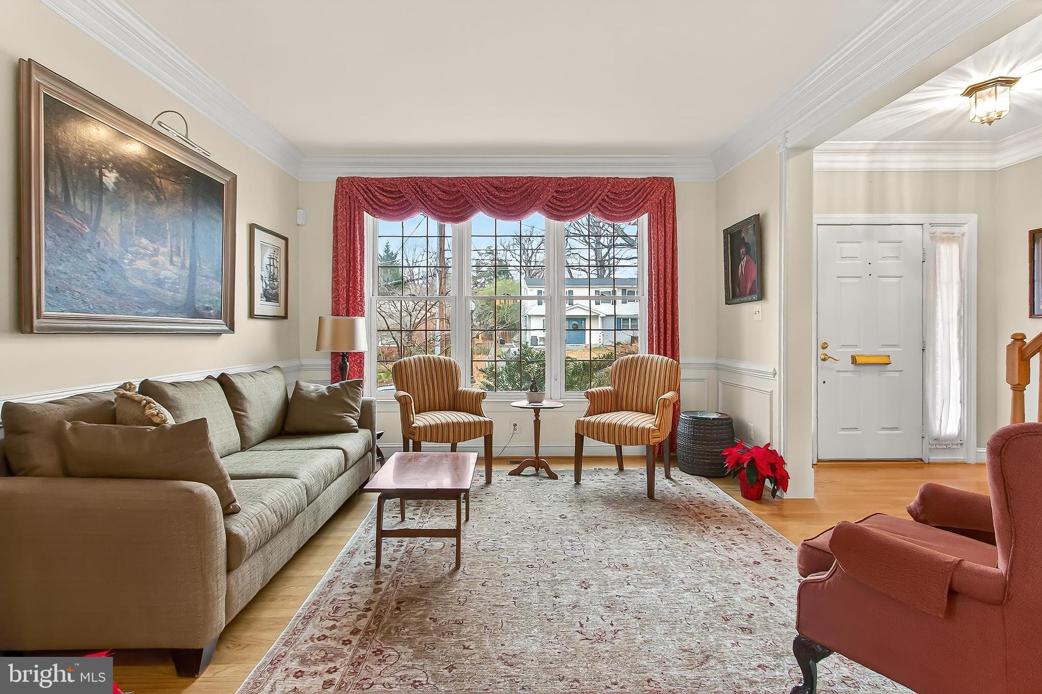 4818 9th Street South Arlington, VA 22204 - Photo 11 of 57 a living room with furniture and a large window