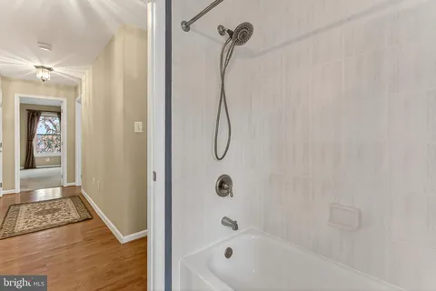 a view of a livingroom with furniture and a wooden floor