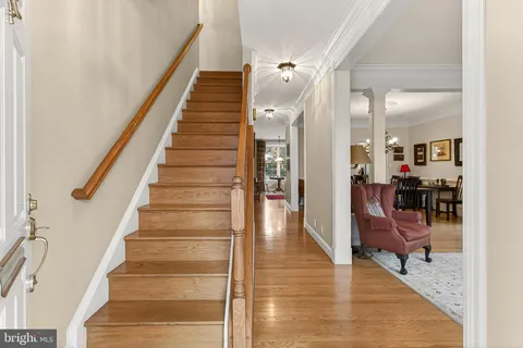 a view of an entryway with wooden floor