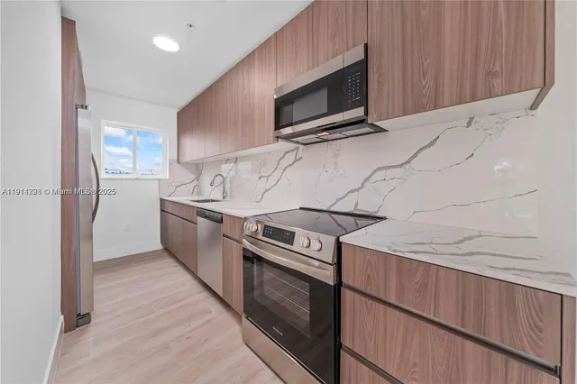 a kitchen with a stove microwave and refrigerator