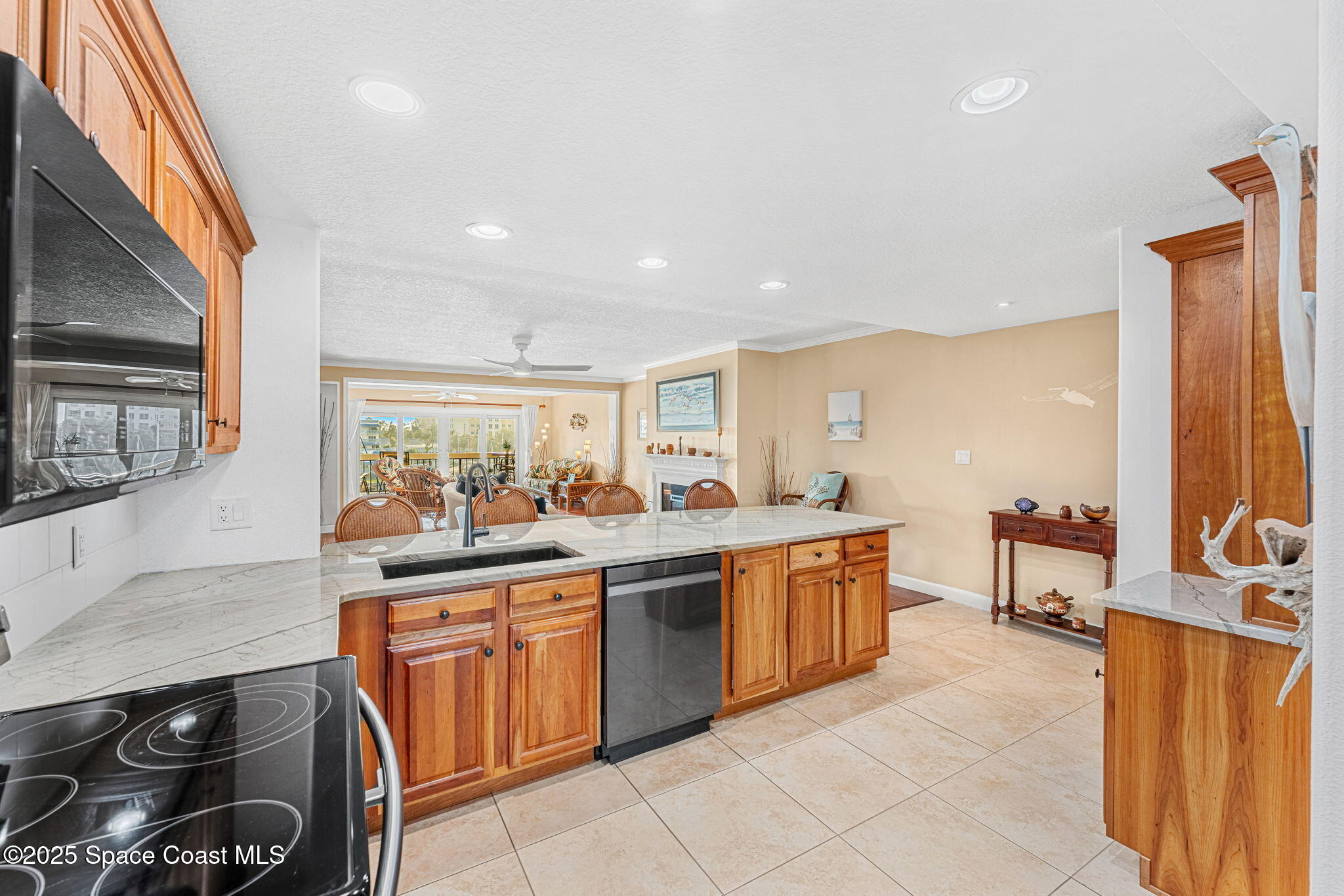 2220 Front Street, Unit 404 Melbourne, FL 32901 - Photo 11 of 51 a kitchen with stainless steel appliances granite countertop a sink and cabinets
