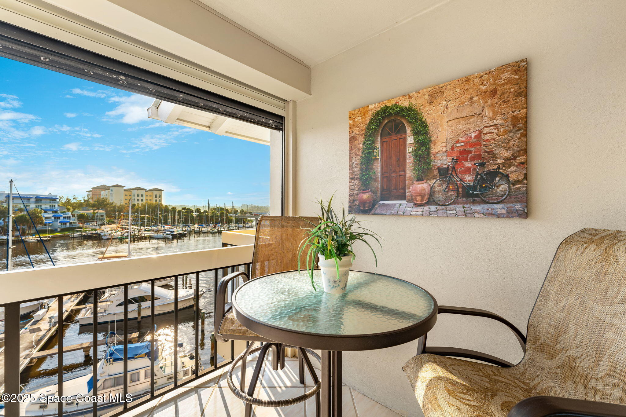 2220 Front Street, Unit 404 Melbourne, FL 32901 - Photo 20 of 51 a view of a balcony dining table and chairs
