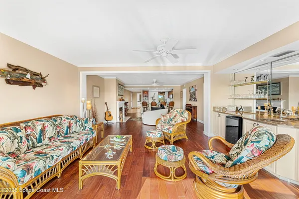 a living room with fireplace furniture and a wooden floor
