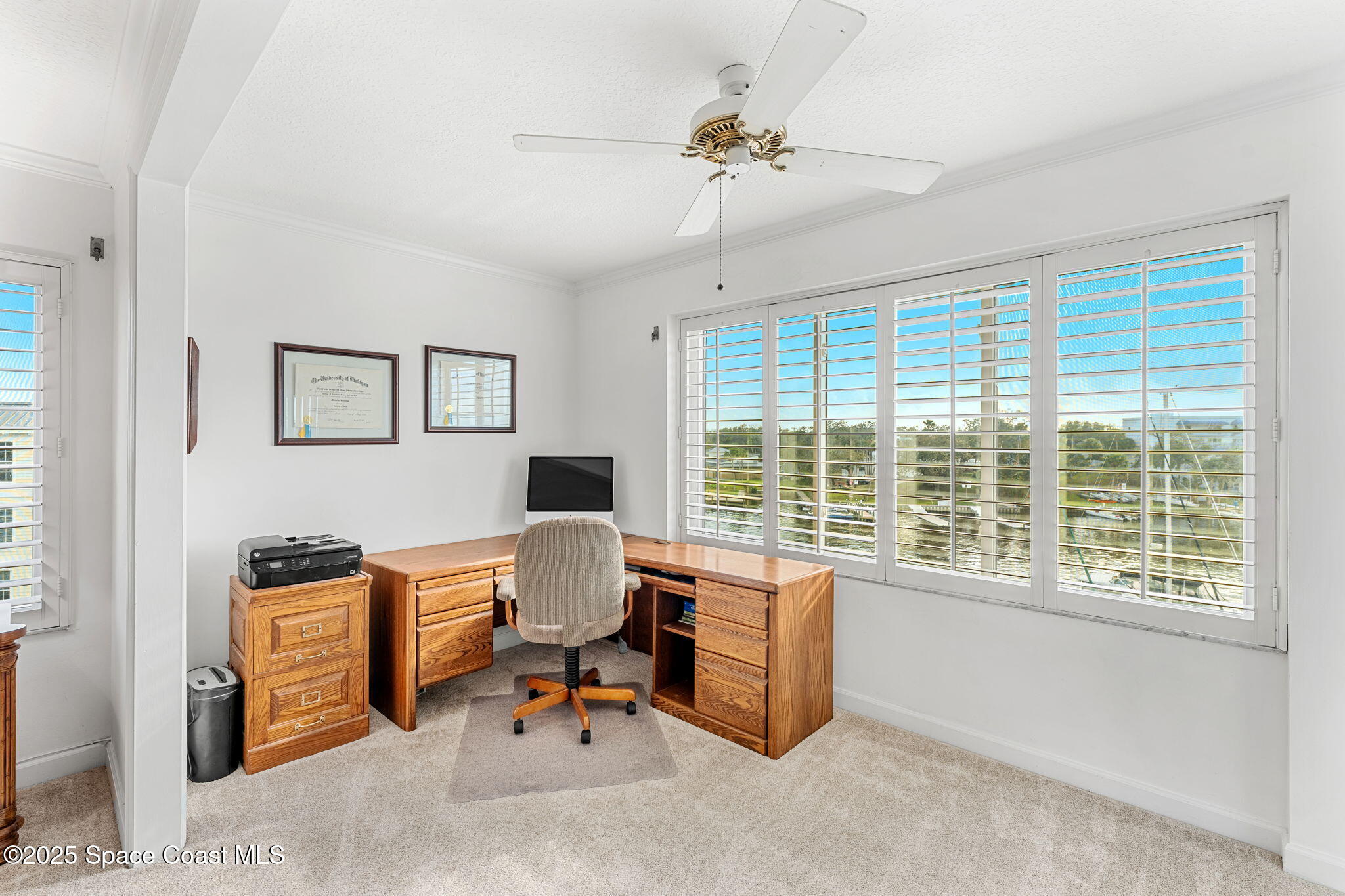 2220 Front Street, Unit 404 Melbourne, FL 32901 - Photo 33 of 51 a view of a workspace with furniture and a window
