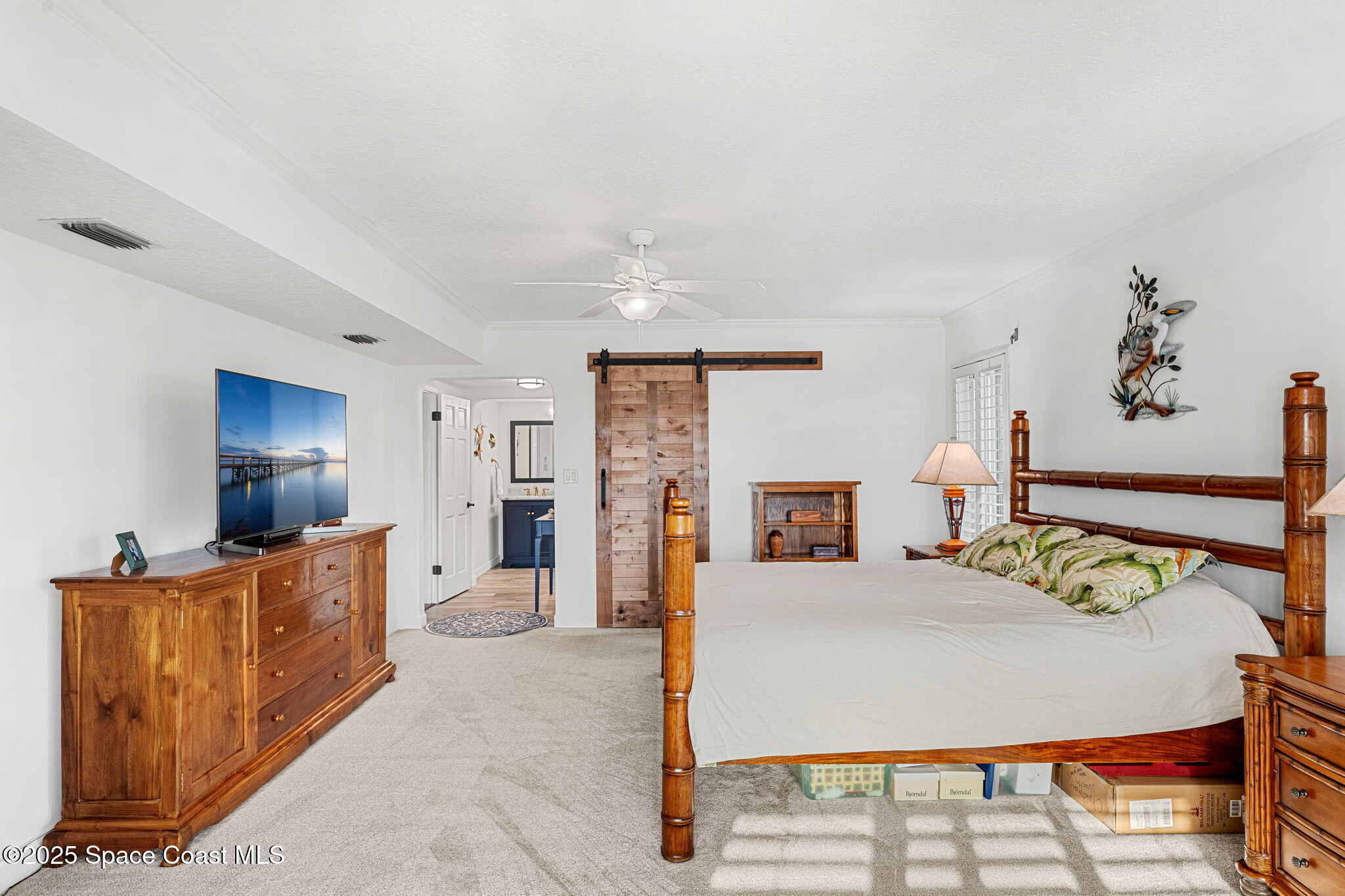 2220 Front Street, Unit 404 Melbourne, FL 32901 - Photo 34 of 51 a bed room with furniture and a flat screen tv