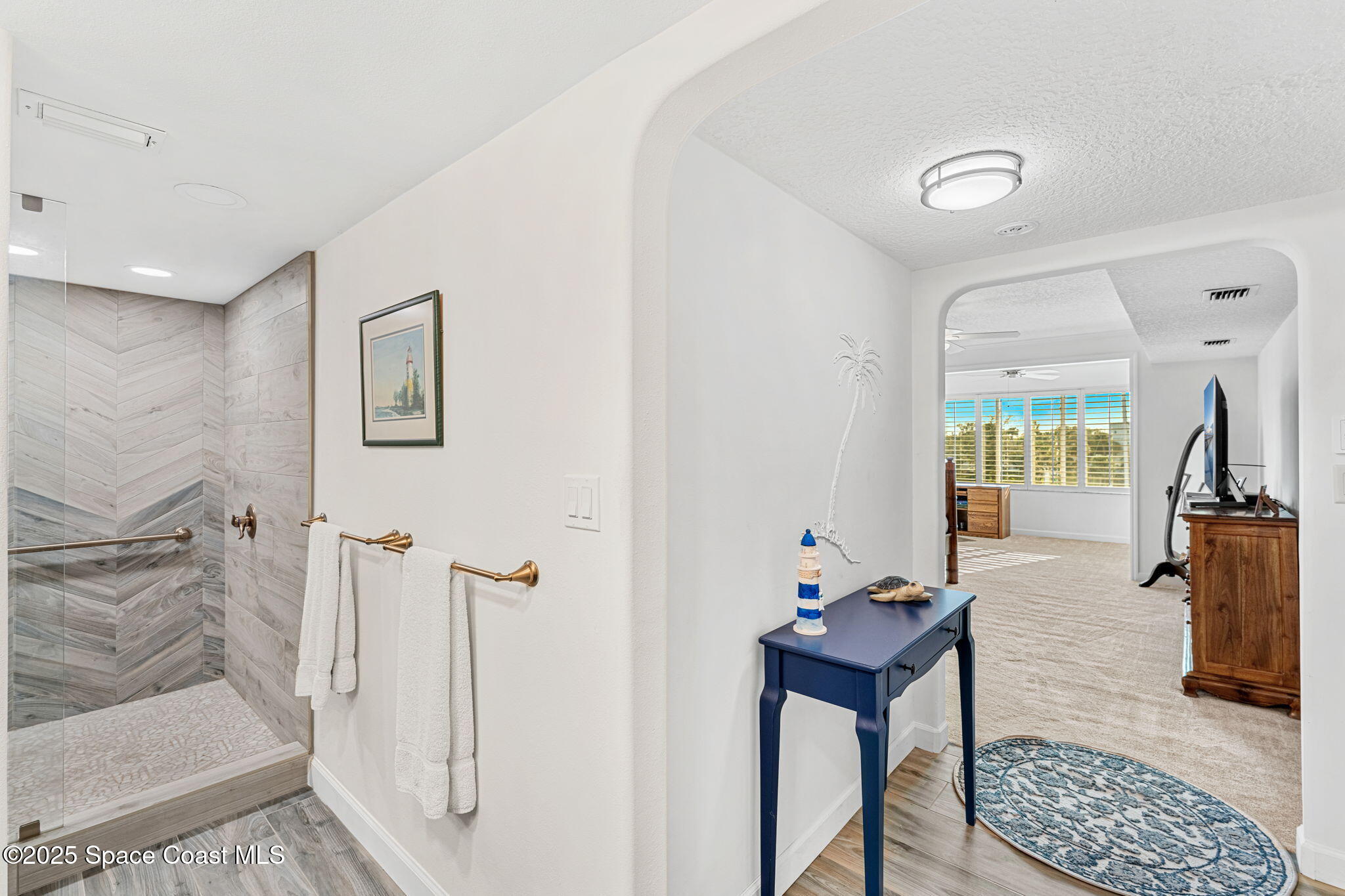 2220 Front Street, Unit 404 Melbourne, FL 32901 - Photo 35 of 51 a hallway with furniture and a window
