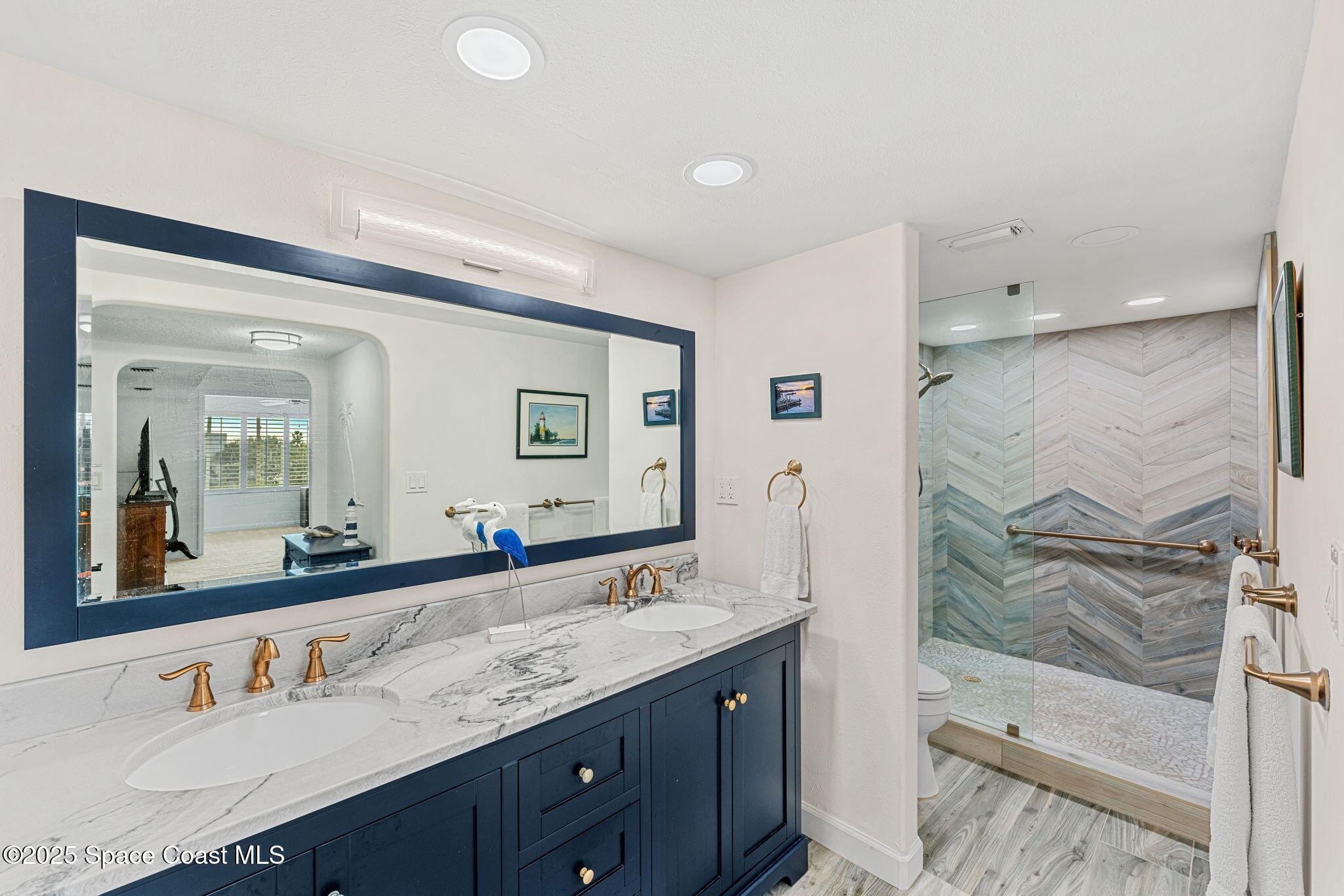 2220 Front Street, Unit 404 Melbourne, FL 32901 - Photo 36 of 51 a bathroom with a granite countertop sink mirror and double